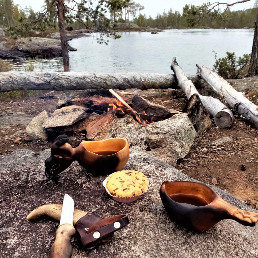 hand carved kuksa by the campfire in sweden norrbotten