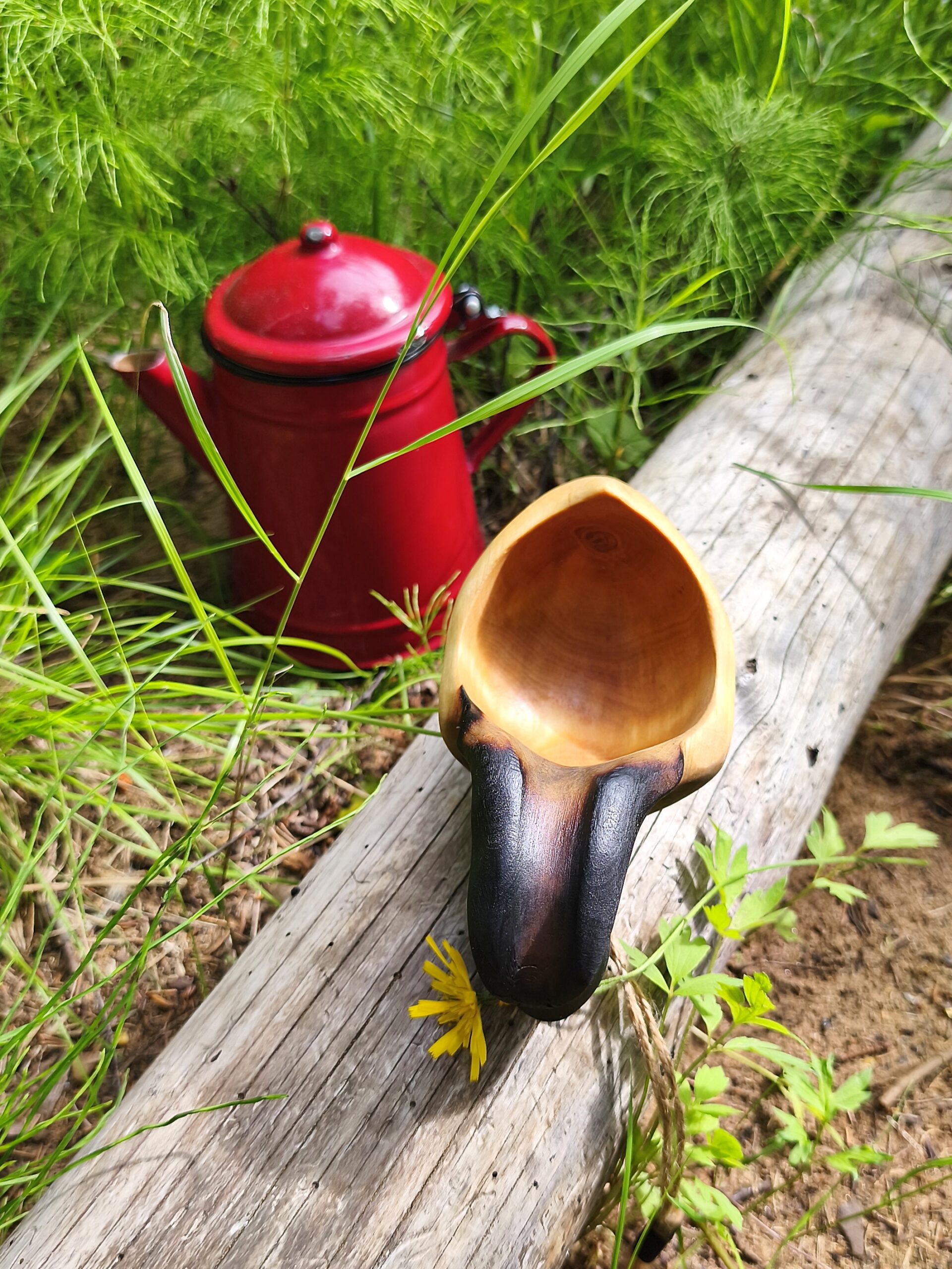 Hand-carved wooden camping cup from Northern Sweden, perfect for coffee by the campfire.